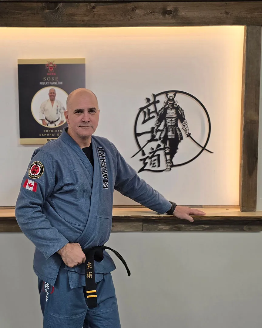 Vanguard instructor teaching an adult Jiu-Jitsu technique
